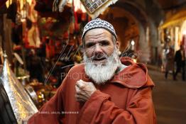 Image du Maroc Professionnelle de  Si Lhoucine le plus petit Bazar Tinmal dans une importante rue commerciale dans le Souk des Habous. Parmi les endroits les plus pittoresques de Casablanca, la Cité de Habous conçue par les architectes Auguste Cadet et Edmond Brion d’après l’ébauche d’un premier plan-masse dû à Albert Laprade. La construction n’avait commencé qu’après la première guerre mondiale. Situé près du Palais Royale, ce joyau architectural est le point de départ de la nouvelle médina de la ville, Vendredi 18 Novembre 2011. Le quartier des Habous fait partie du patrimoine architectural de Casablanca (Photo / Abdeljalil Bounhar) 